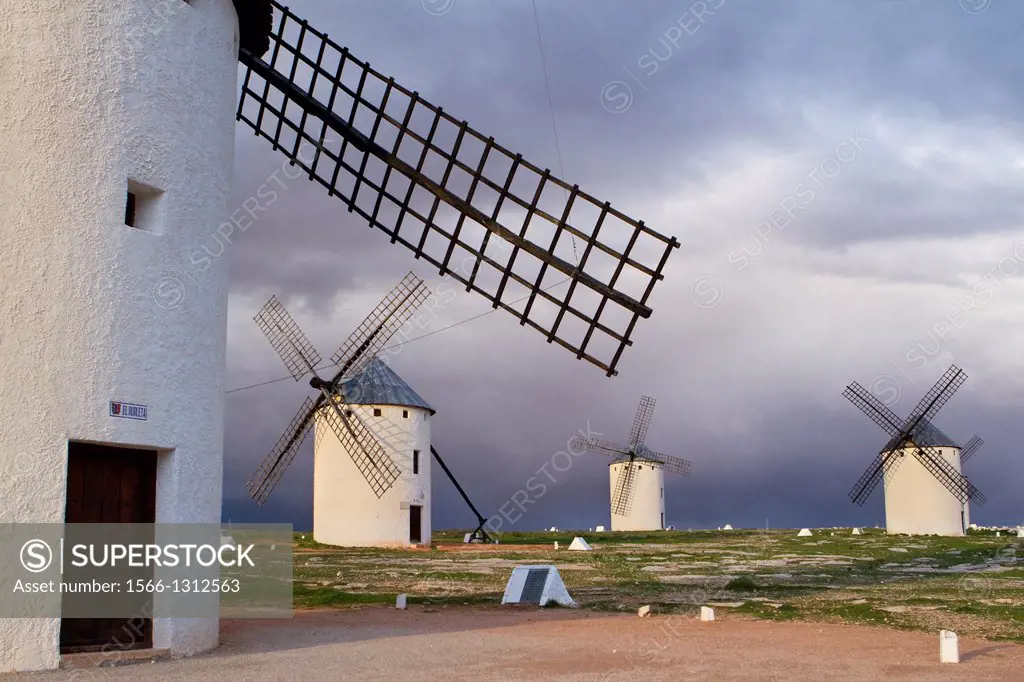 Typical windmills at sunset in Campo de Criptana village, in the Route of Don Quiijote, Ciudad Real province, Castilla-La Mancha, Spain.