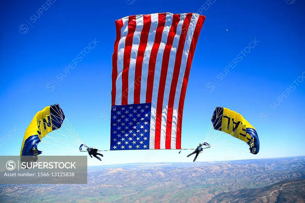 SAN DIEGO, Calif. (Feb. 15, 2016) - Members of the U.S. Navy Parachute Team, the Leap Frogs, perform a tethered flag during a training demonstration. ...