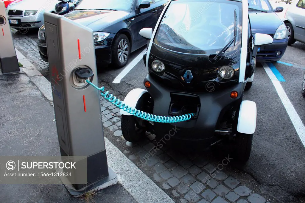 renault twizy electric car being charged at a charging station in rome italy.