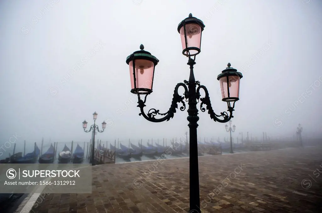Venice waterfront covered in thick fog, Italy.