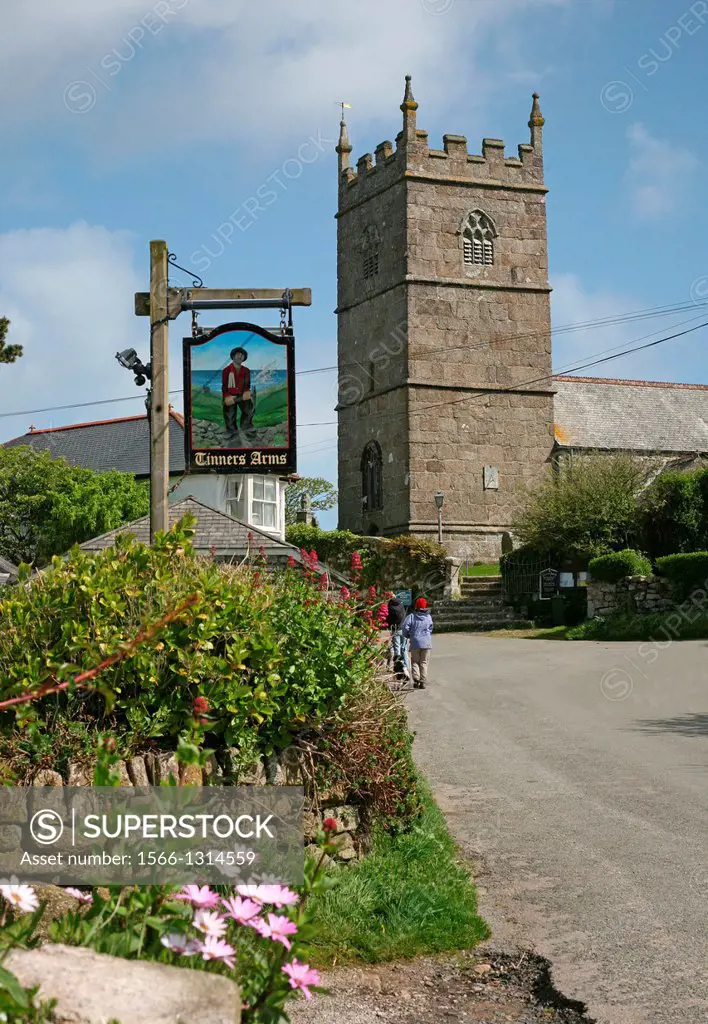The Tinners Arms pub sign and the village church of St Senara at Zennor Cornwall England UK.
