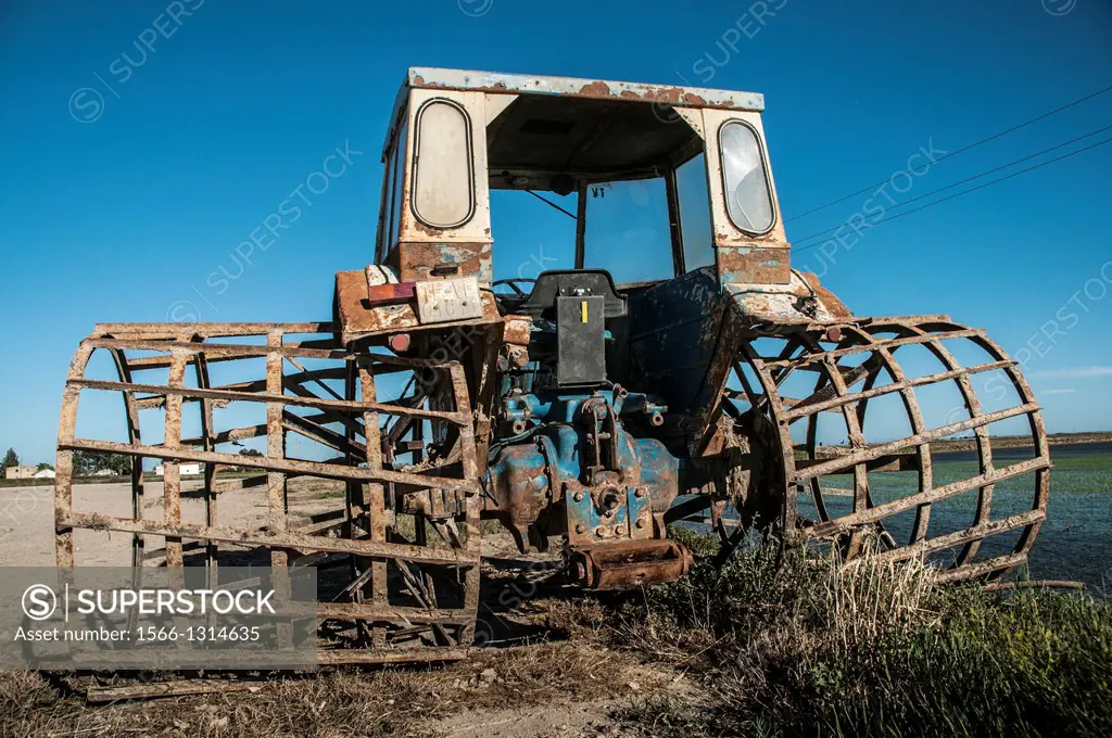 Tractor with special wheels to work in the rice fields, Ebro Delta, Catalonia, Spain.