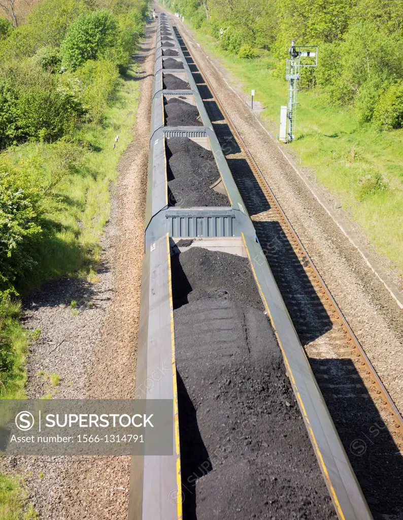 Coal freight train transporting imported coal to Drax power station in Yorkshire from The Port of Tyne at Newcastle, England, UK.