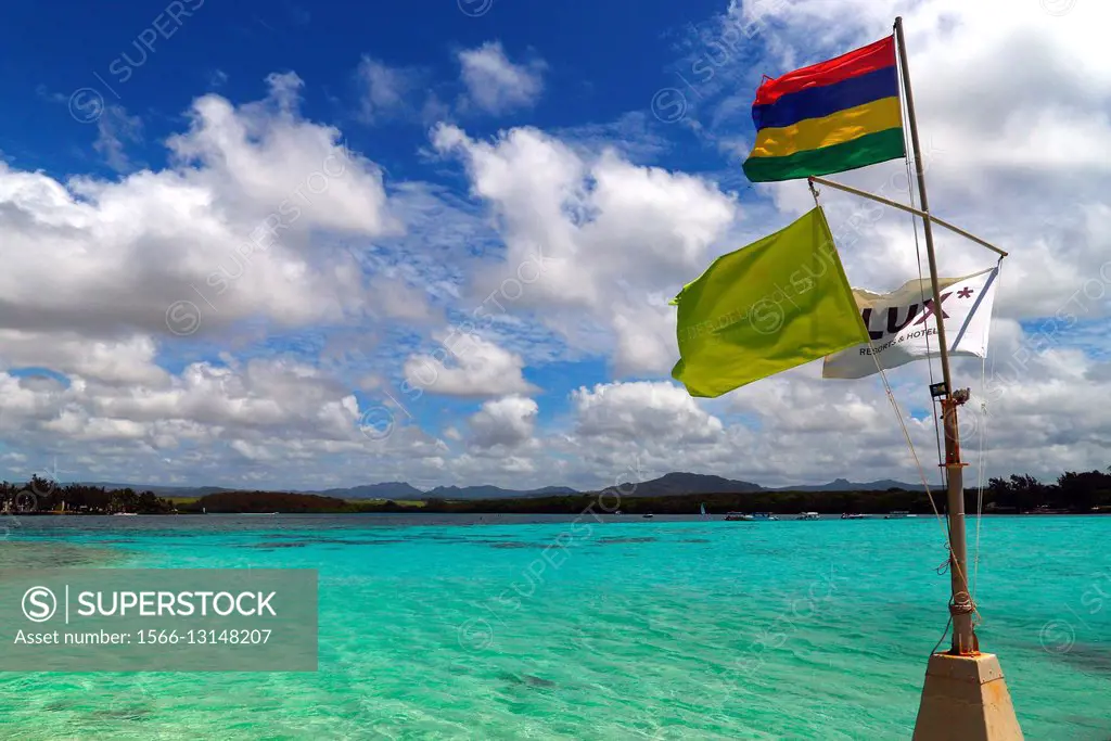 Flags of Mauritius, of islet - Île des Deux Cocos, and of local hotel, islet - Île des Deux Cocos, Blue Bay, Grand Port, Mauritius, Africa