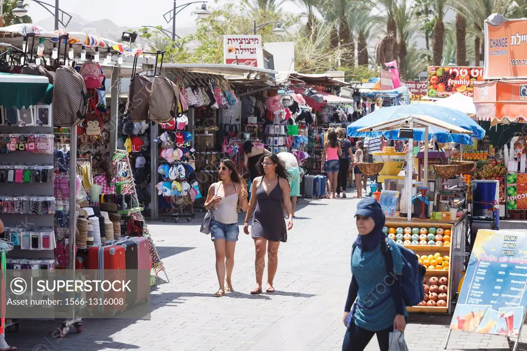 People walking by the promenade, Eilat, Israel.