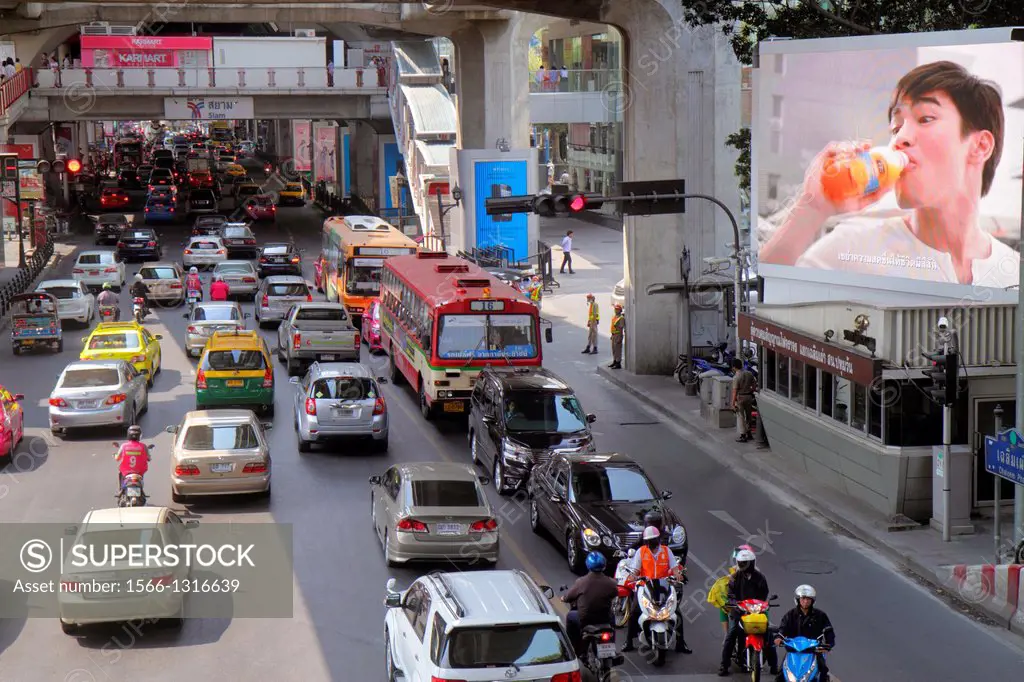 Thailand, Bangkok, Pathum Wan, Rama 1 Road, traffic, taxi, taxis, cabs, motorcycles, motor scooters, bus, Skywalk, view, overhead, aerial, billboard, ...