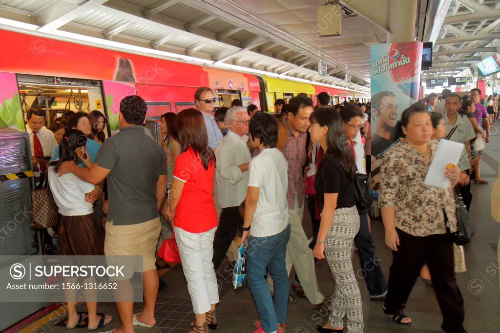 Thailand, Bangkok, Pathum Wan, Phaya Thai Station, Bangkok Mass Transit System, BTS Skytrain, public transportation, platform, Asian, woman, man, comm...