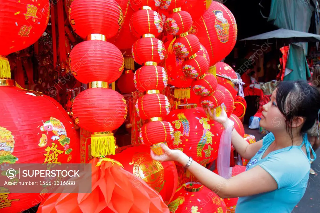 Thailand, Bangkok, Samphanthawong, Chinatown, Yaowarat Road, Chinese New Year, Asian, woman, shopping, paper, lanterns, sale.