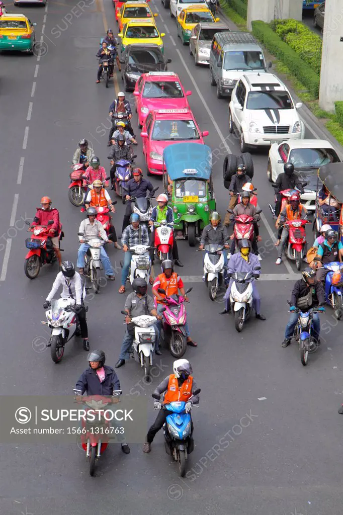 Thailand, Bangkok, Pathum Wan, Phaya Thai Road, traffic, taxi, taxis, cabs, motorcycles, motor scooters, auto rickshaw, tuk-tuk, sam-lor, Skywalk, vie...