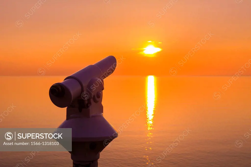 Telescope at Valley of the Rocks at sunset in Exmoor National Park on the South West Coast Path near Lynton, Devon, England.