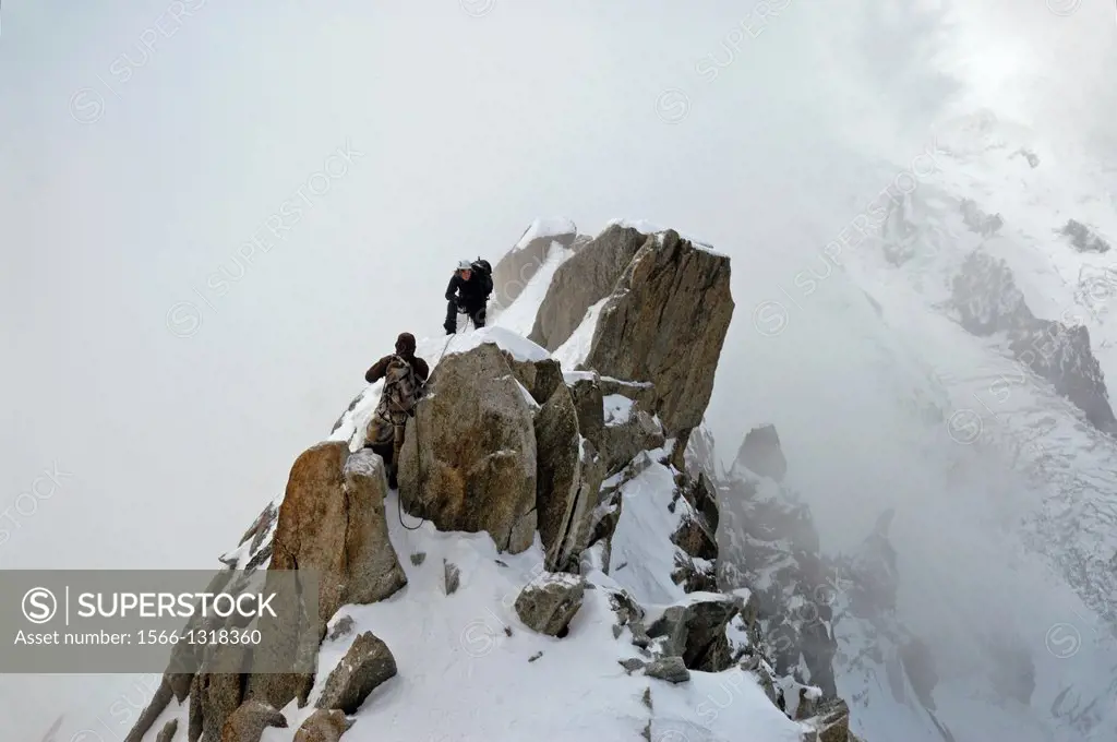 climbing climbers, Mont Blanc massif, Aiguille du Midi , close to Chamonix , French Alps, France