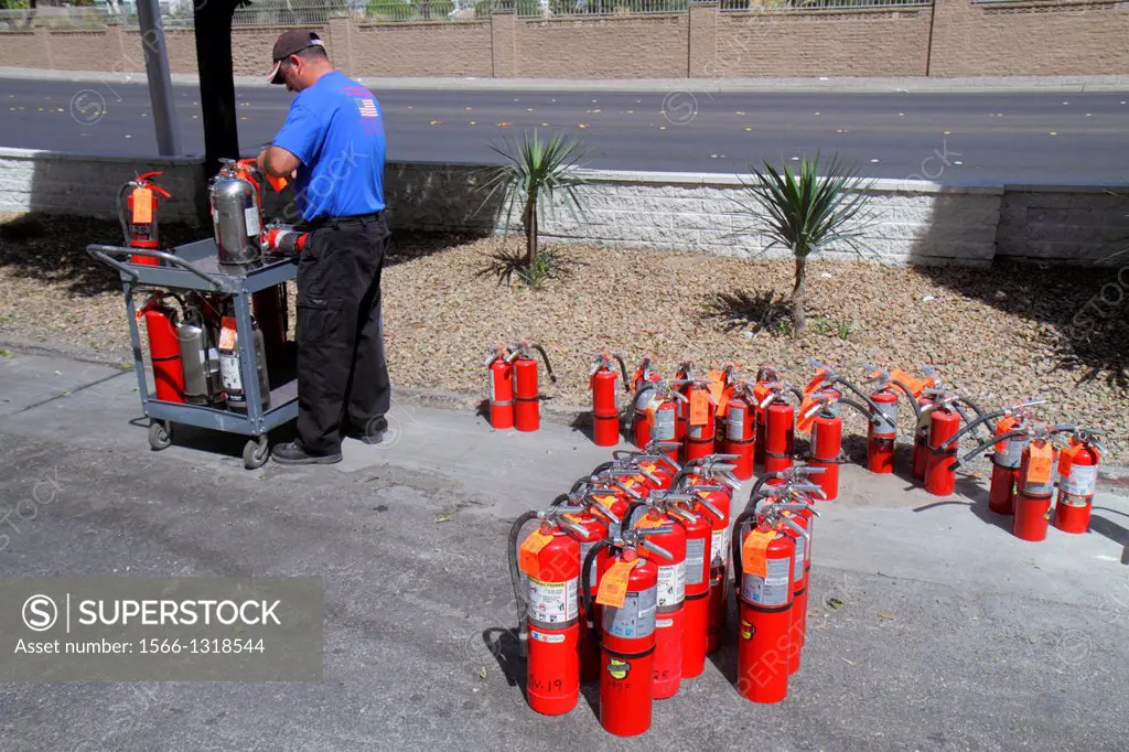 Nevada, Las Vegas, Las Vegas Hotel & Casino, LVH, fire extinguishers, man, working, installer, repairman.