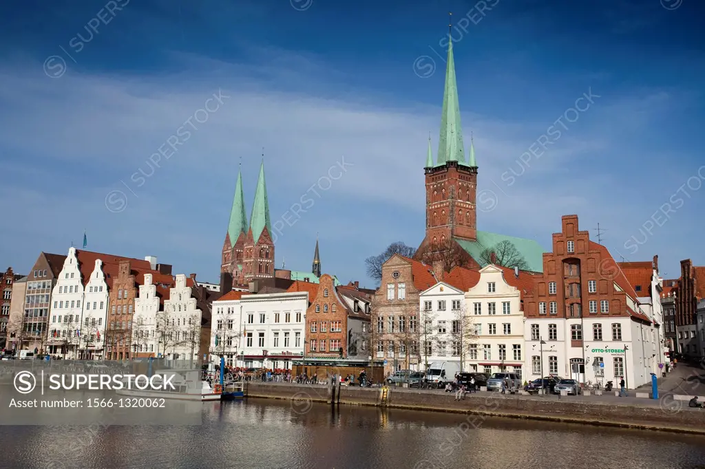 View of Lubeck, from the other side of one of the canals that surround the city, highlighting the tower of the Church of Santa Maria, and the tower of...