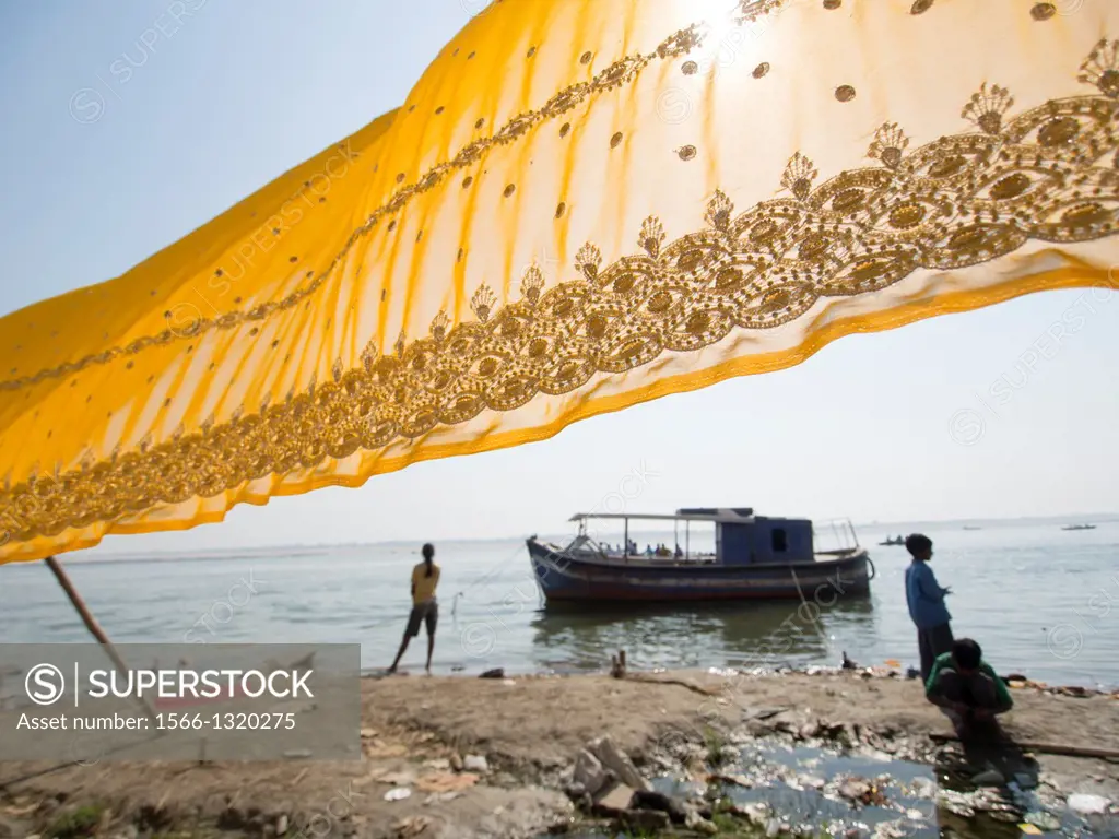 Sari being dried in front of a river in Varanasi, Uttar Pradesh, India.