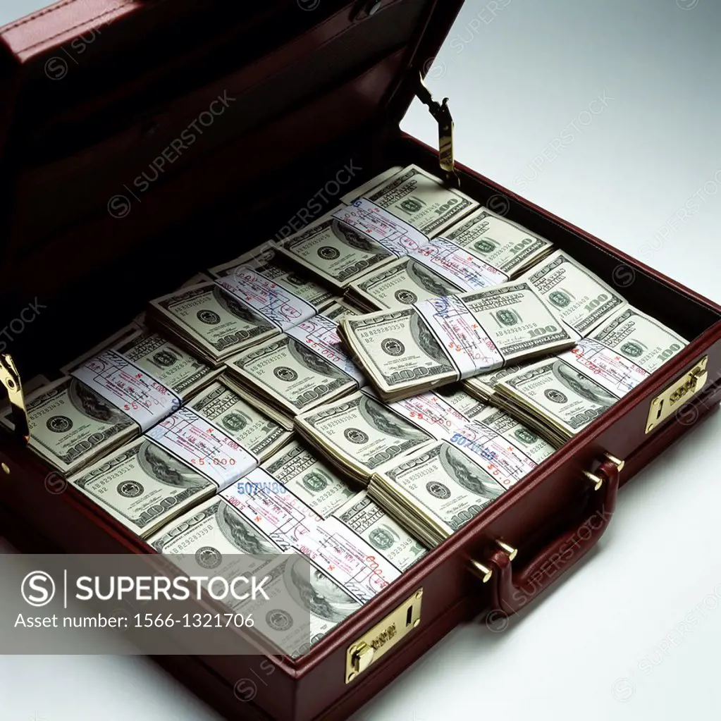 Briefcase with stacks of bundled 100 US Dollar bills.