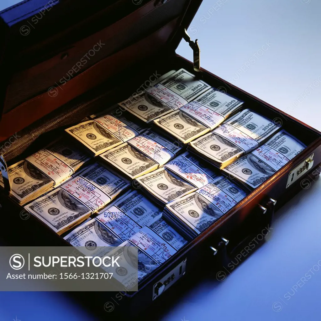 Briefcase with stacks of bundled 100 US Dollar bills.