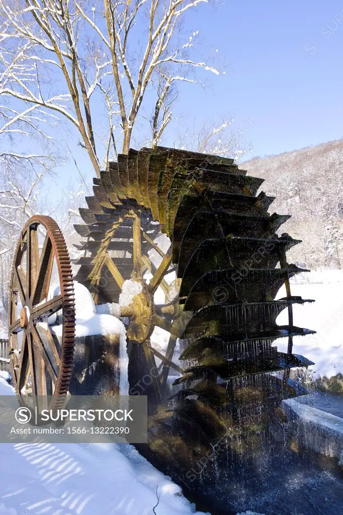 Old water wheel of an historic water mill in the Schmiechtal valley near Ulm, Germany.