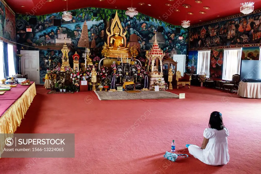 Florida, Orlando, Kissimmee, Wat Florida Dhammaram Buddhist Monastery, temple, inside, Asian, woman, praying, sitting,