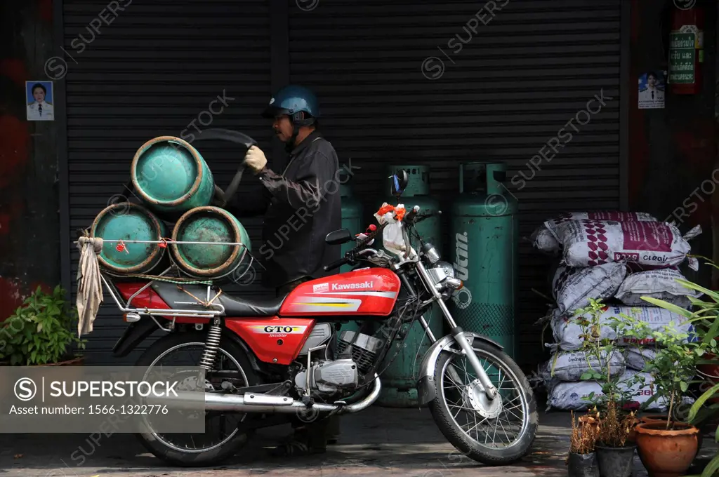 Gas bike is delivering gas bottles