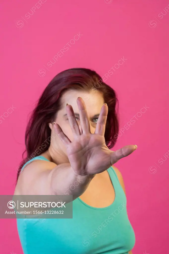 Woman showing a talk to the hand gesture.
