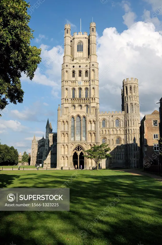 Ely Cathedral, Cambridgeshire, England. Over Palace Green to the West Tower and the West Door.