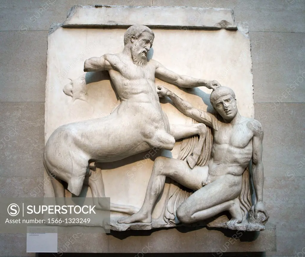 Elgin Marbles. British Museum, London. Sculpture marble metope figures from the Parthenon. Centaur and Lapith in mortal combat.