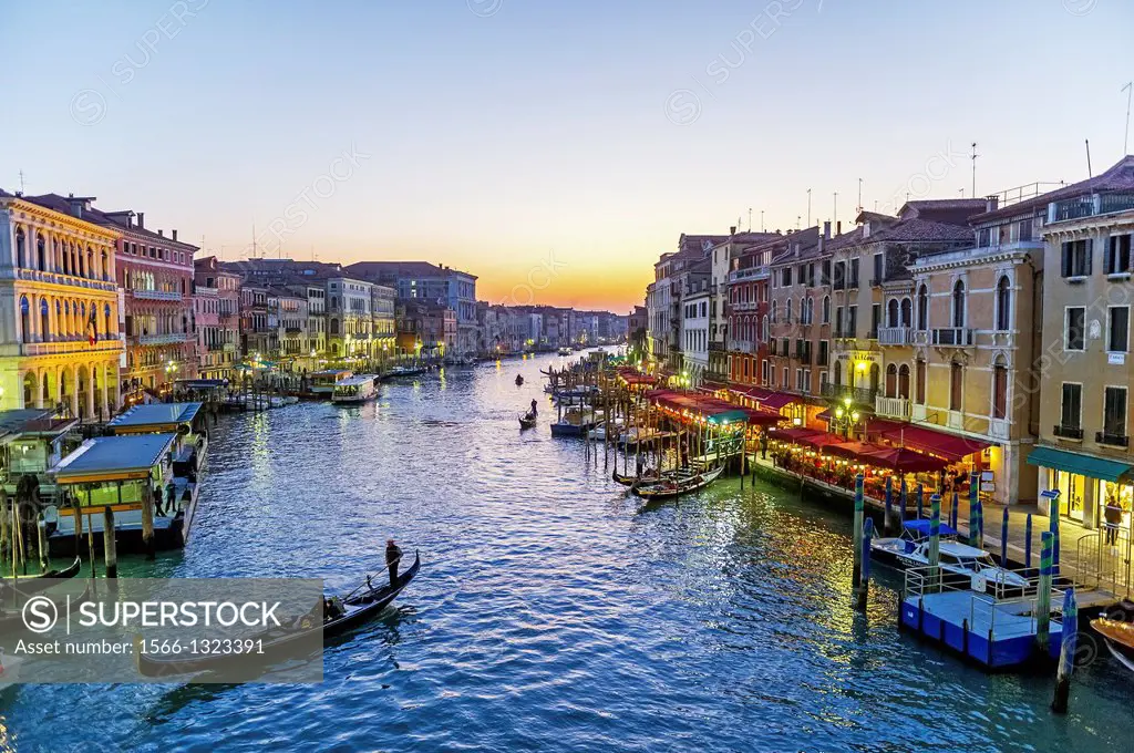 Europe, Italy, Veneto, Venice, classified as World Heritage by UNESCO. Gondola in the Grand Canale at sunset.