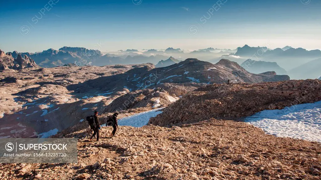 Europe, Italy, Trentino, Pale di San Martino. Hikers in the lunar landscape of the Pale di San Martino plateau.