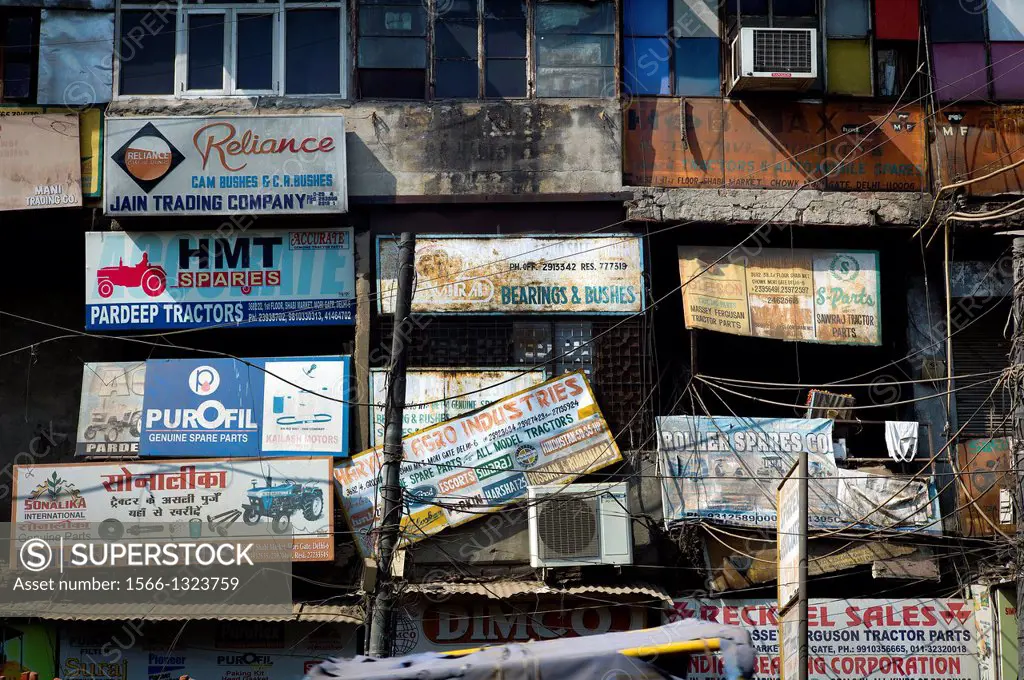 close-up of several adverts on a street in Delhi, India, Asia