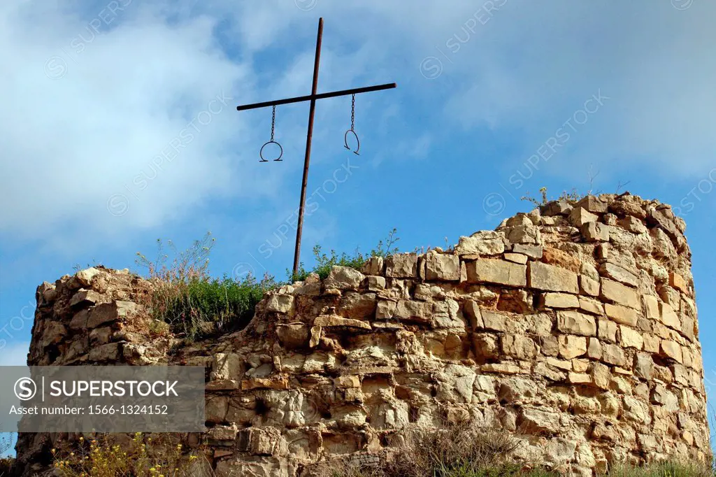 Ruins of medieval tower and iron cross, Ciutadilla, Urgell, Catalonia, Spain