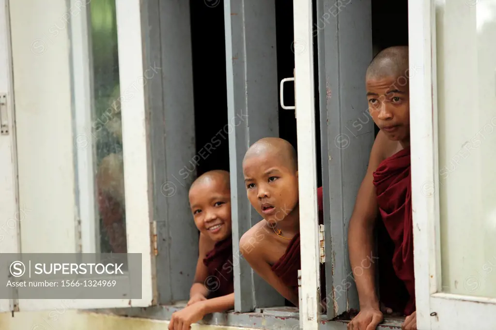 three novices looking out of a window, Burma