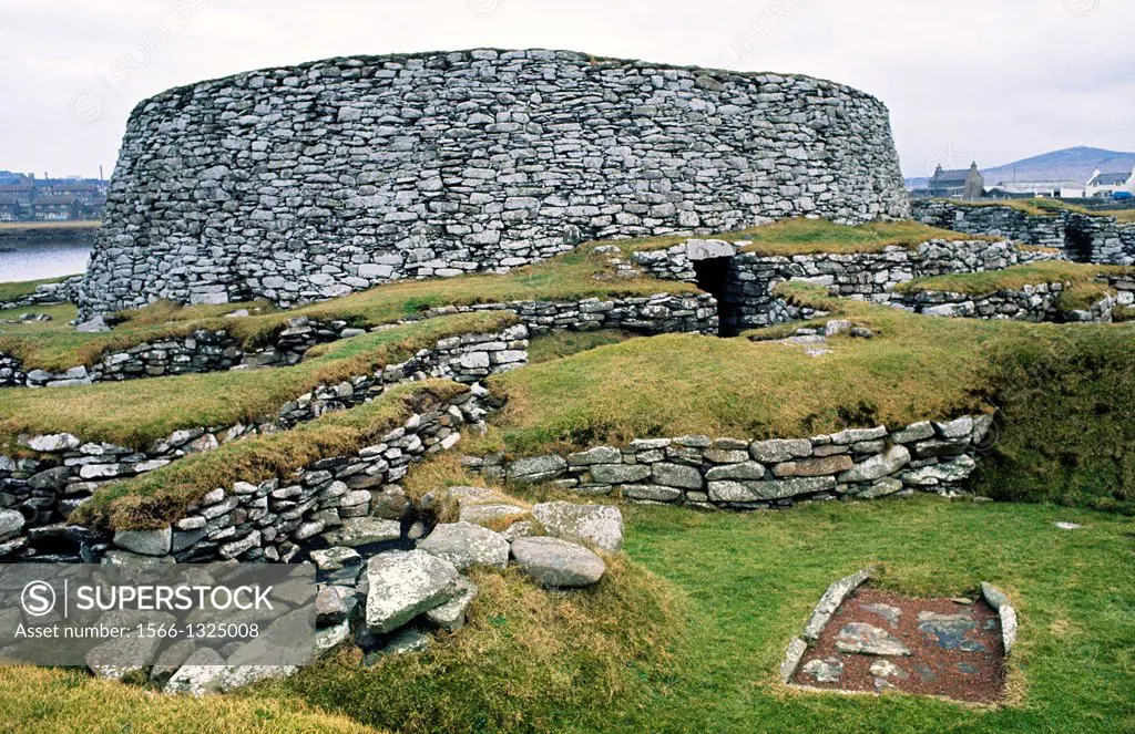 Massive broch walls and surrounding rooms of Clickhimin prehistoric broch defensive settlement at Lerwick, Shetland, Scotland.