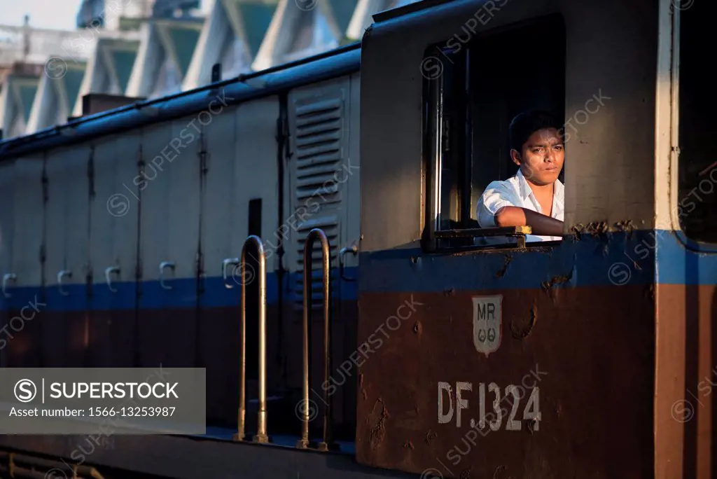 Portrait of a train driver at the Yangon Railway station, Myanmar.