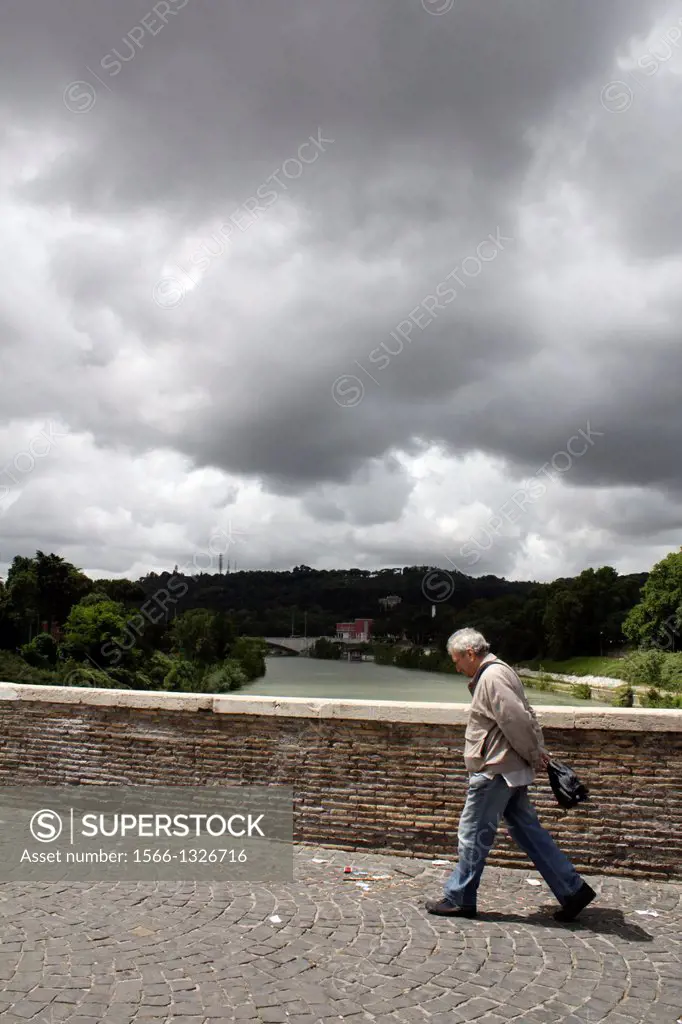 old man crossing ponte milvio bridge in rome italy