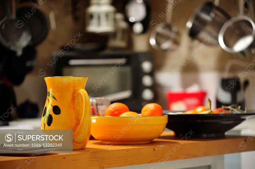 yellow pitcher in a kitchen, Lauzun, Lot-et-Garonne department, Aquitaine, France.