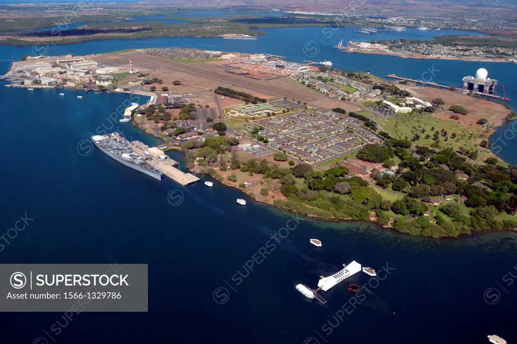 Aerial view of Ford Island with Arizona Memorial and USS Missouri, the ""Mighty Mo"" ship, docked at Pearl Harbor, Oahu, Hawaii, USA.