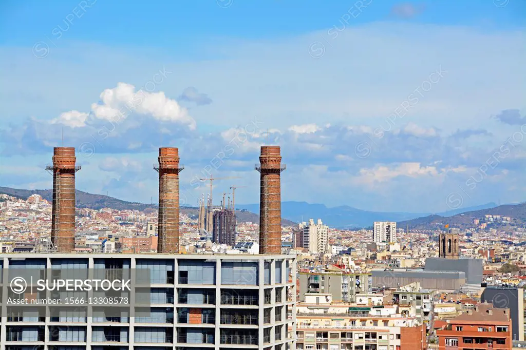The three chimneys is a historical landmark. In the background we can see the Urquinaona Tower and the Sagrada Familia Temple. Barcelona, Catalonia, S...