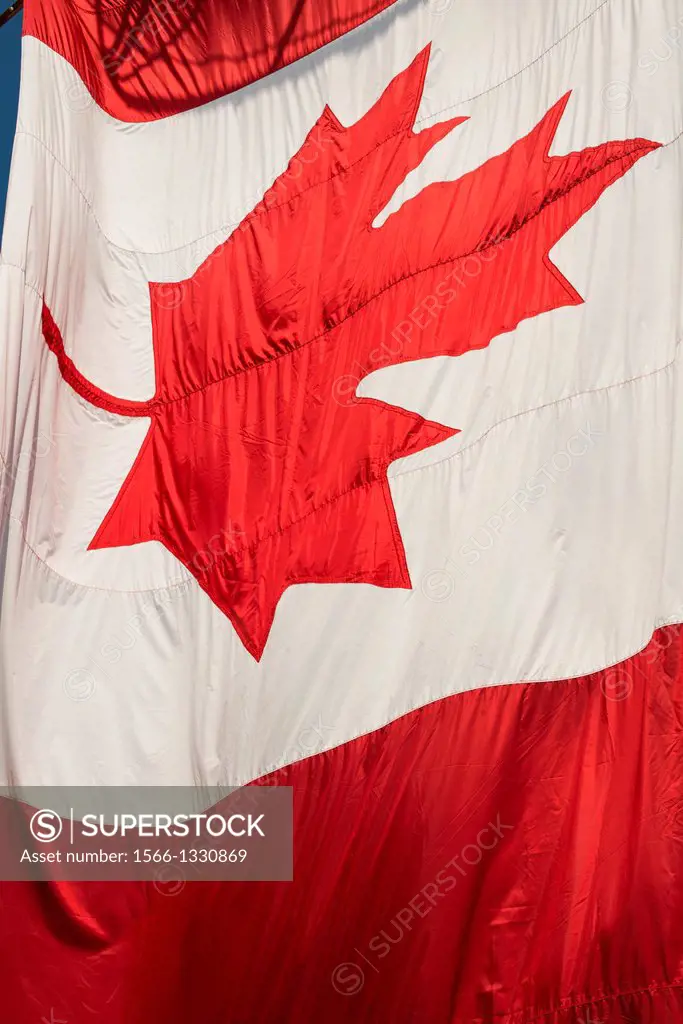 the large Canadian flag flies over Granville Island, Vancouver, BC, Canada, every July 1, Canada Day.