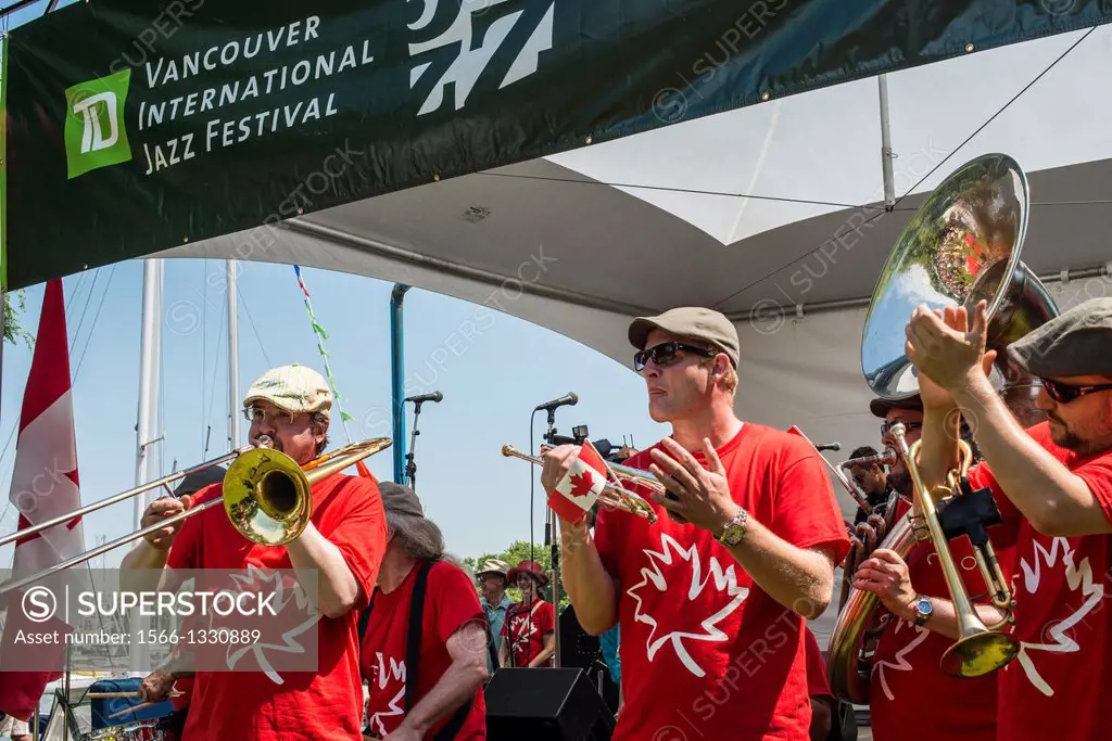 a band plays music on Canada Day on Granville Island, Vancouver, BC, Canada