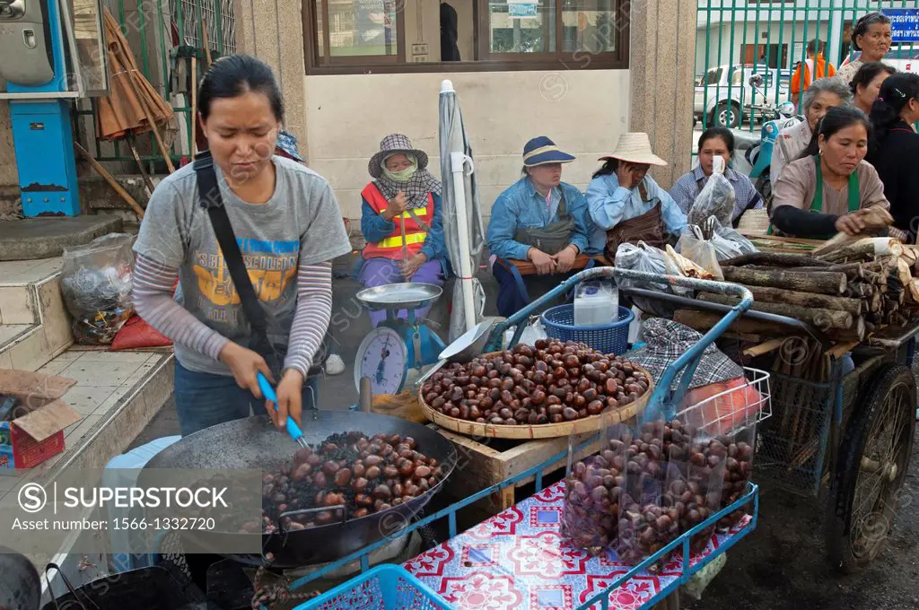 Woman vendors selling chestnuts, Chiang Rai, Thailand