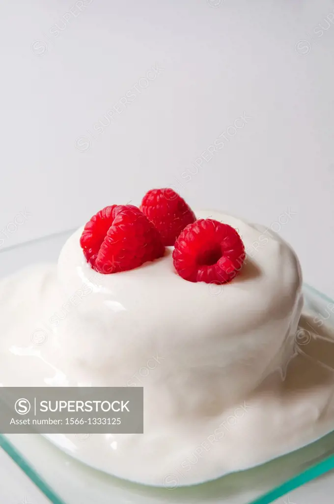 Dessert: cream cake with raspberries. Close view.