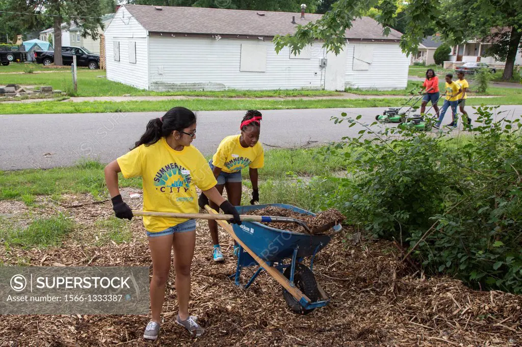 Detroit, Michigan - High school volunteers work in a community garden in Brightmoor, one of the most distressed neighborhoods of Detroit. They are par...