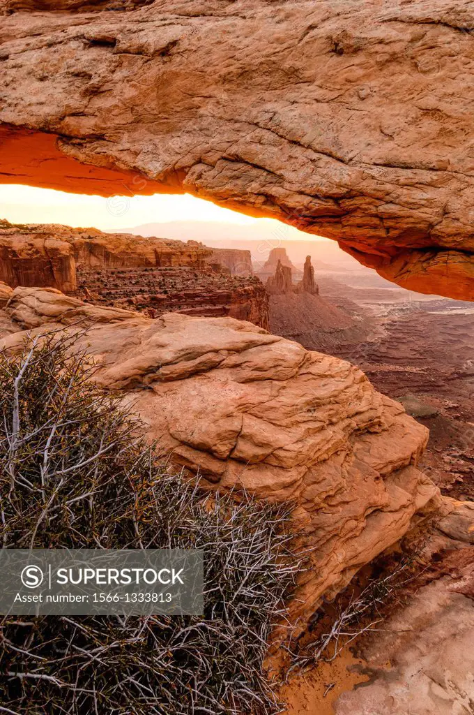 View under Mesa Arch in Canyonlands National Park at sunrise.