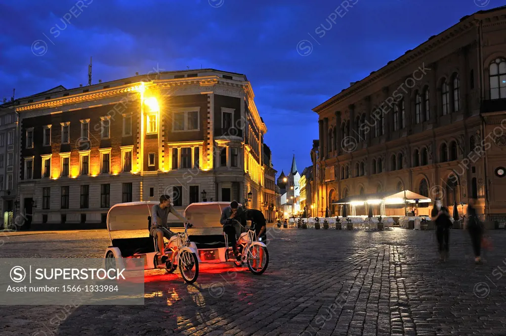 pedicab on Dome Square by night, Old Town, Riga, Latvia, Baltic region, Northern Europe
