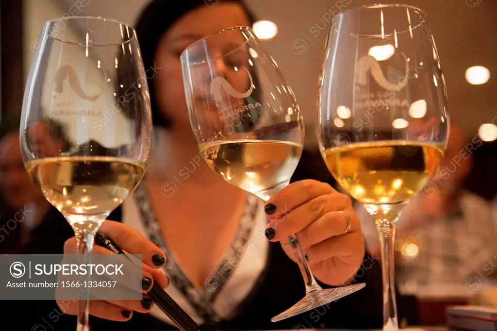 Woman tasting white wine. Wine tasting session. Navarre. Spain.