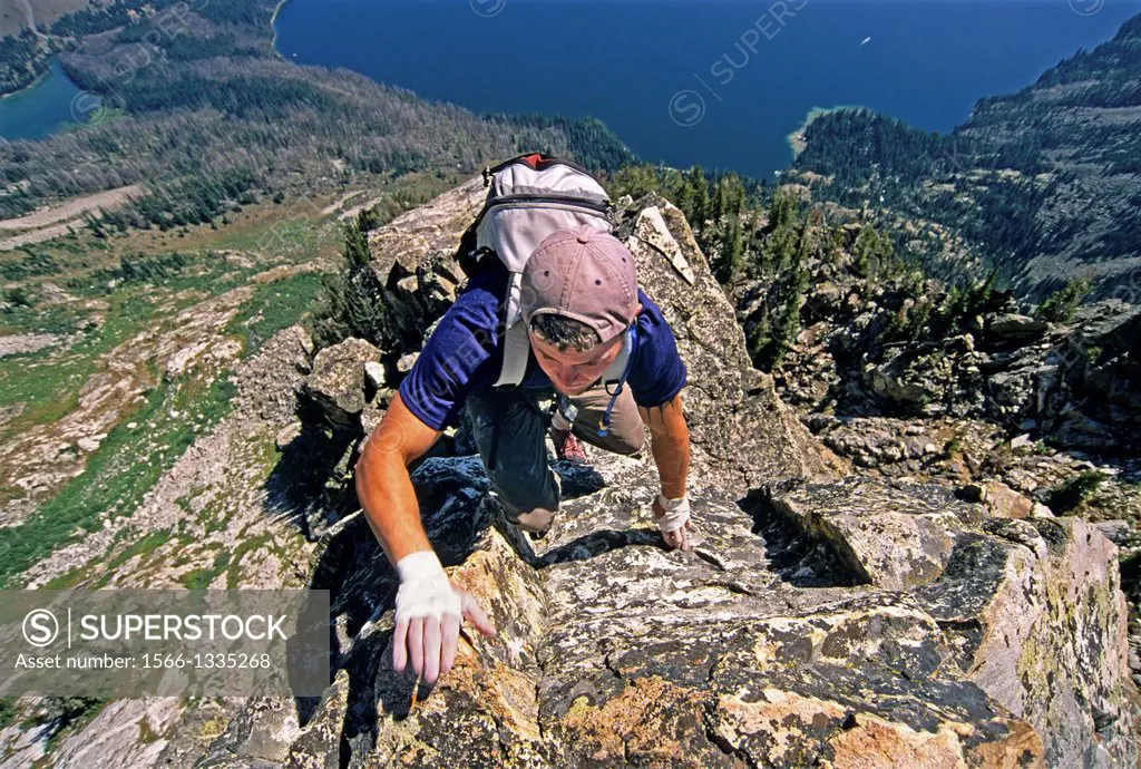Rock climbing the East Ridge route which is rated 5,4 and located on Cube Point high above Jenny Lake in Grand Teton National Park in northern Wyoming...