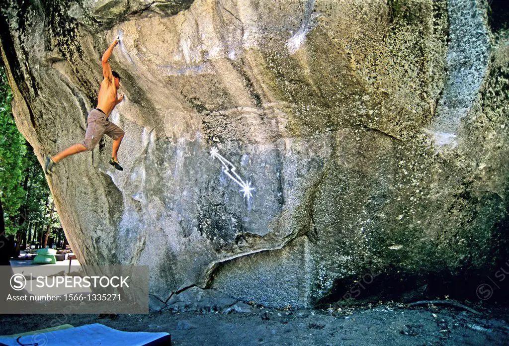 bouldering a world famous rock climb called Midnight Lightning which is rated V,7 and located on the Columbia Boulder in Yosemite Valley at Yosemite N...