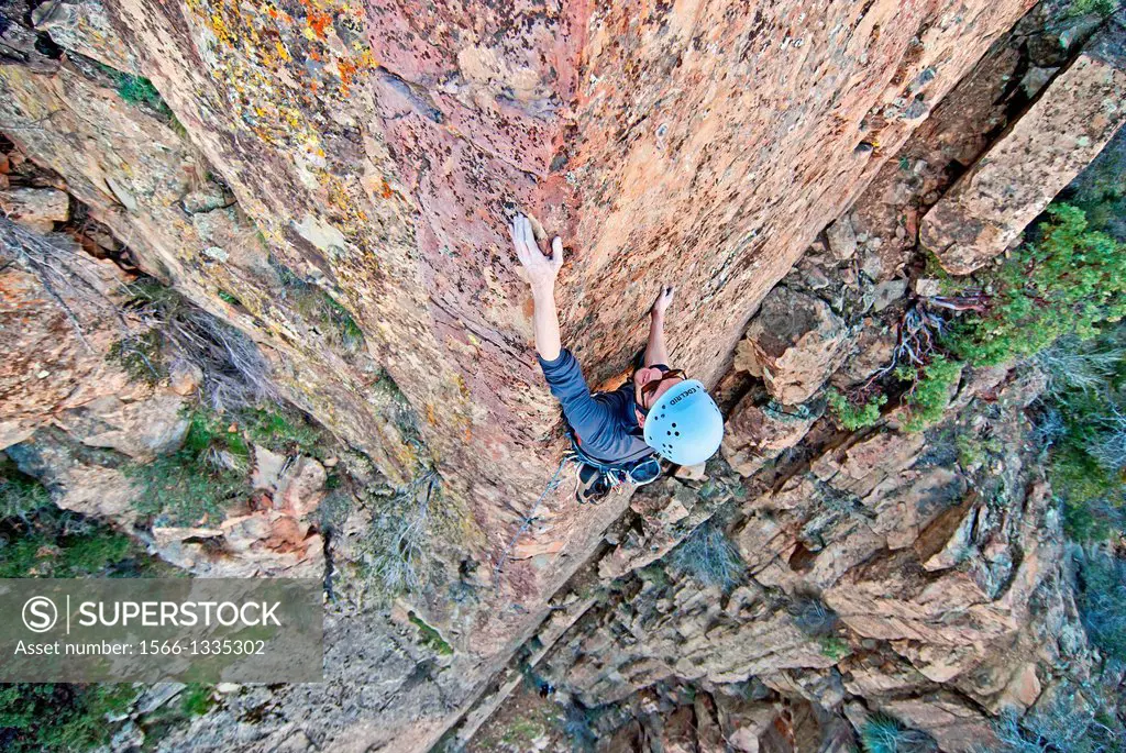 Rock climbing a route called Permanent Income Hypothesis which is rated 5,9 and located on The Fortress in the Sespe Mountains in southern California.