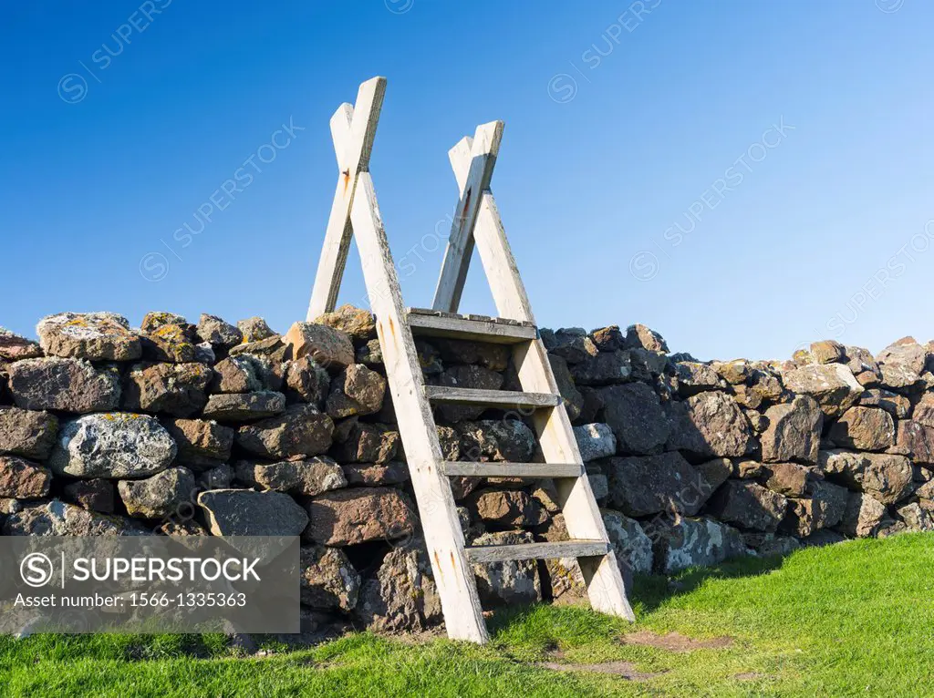 Stile crossing a dry stone wall on a coastal walk. europe, central europe, northern europe, united kingdom, great britain, scotland, northern isles,sh...