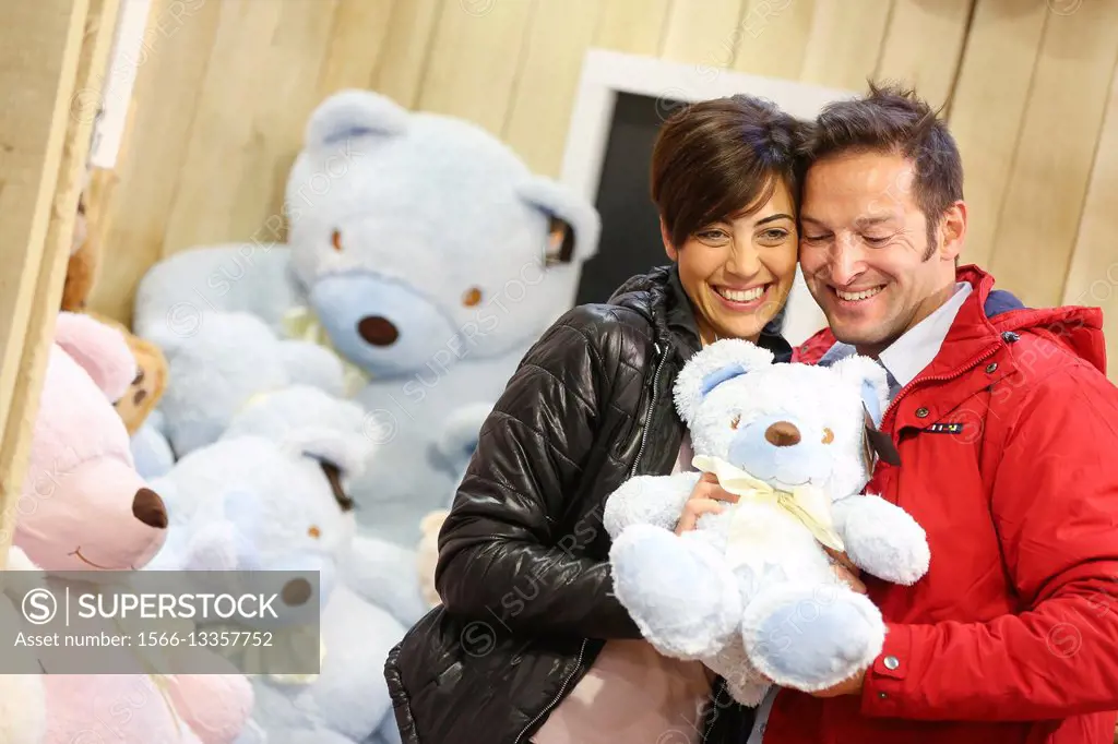 Couple buying teddy bear